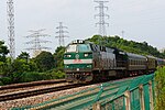 201607 A freight train with maintance coaches passes Xingqiao Station.jpg