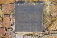 A memorial to the Abbé de la Caille and Thomas Maclear, at Aurora, Western Cape, South Africa.  The English portion of the inscription reads:  This is the site of the Maclear Beacon positioned in 1838 near the original North Terminal of the Arc of Meridian positioned by Abbé de la Caille, the first surveyor to introduce Geodetic Surveying into South Africa.
