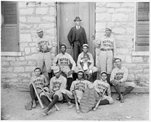 Baseball team in 1900 (African American baseball players from Morris Brown College, with boy and another man standing at door, Atlanta, Georgia) (LOC) (3971751108).jpg