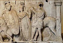 Altar of Domitius Ahenobarbus, c. 122 BC; the altar shows two Roman infantrymen equipped with long scuta and a cavalryman with his horse. All are shown wearing chain mail armour. Altar Domitius Ahenobarbus Louvre n3bis.jpg