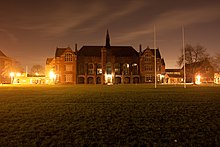 Bedford School's Main School Building at night, viewed from the Sports Field