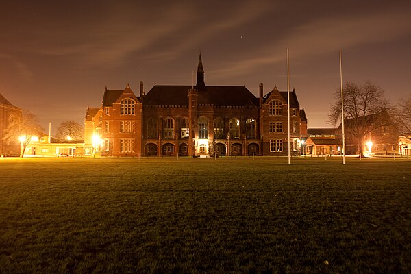 Bedford School's Main School Building at night, viewed from the Sports Field