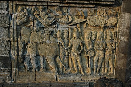 Carved reliefs in Borobudur's lower terraces