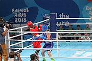 Deutsch: Boxen bei den Olympischen Jugendspielen 2018 Tag 12, 18. Oktober 2018 - Finale Fliegengewicht Mädchen – Martina La Piana (Italien, blau) schlägt Adijat Gbadamosi (Nigeria, rot) 5-0; Ringrichter ist James Beckles (Trinidad und Tobago). English: Boxing at the 2018 Summer Youth Olympics on 18 October 2018 – Girl's flyweight Gold Medal Bout - Martina La Piana (Italy, blue) beats Adijat Gbadamosi (Nigeria, red) 5-0; Referee is James Beckles (Trinidad and Tobago). Español: Boxeo en los Juegos Olímpicos Juveniles de Verano de 2018 en 18 de octubre de 2018 - Combate a medalla de oro de peso mosca para mujeres: Martina La Piana (Italia, azul) le gana a Adijat Gbadamosi (Nigeria, roja) 5-0; El árbitro es James Beckles (Trinidad y Tobago).