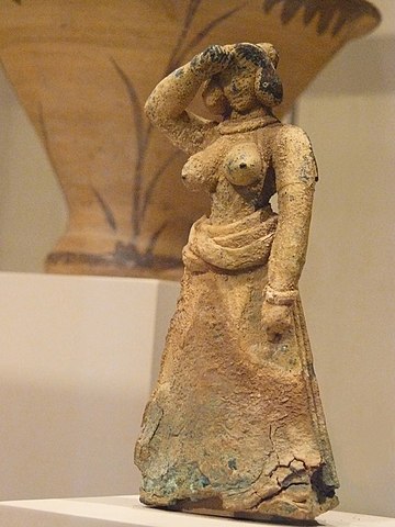 Minoan bronze figurine woman in ecstatic posture