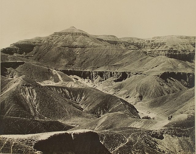 Desert hills and cliffs surrounding a narrow valley