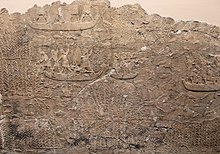 Campaign in the Mesopotamian Marshes of southern Babylonia during the reign of Ashurbanipal. Showing Assyrian soldiers on boat chasing enemies trying to run away; some are hiding in the reeds Campaign in southern Iraq of Ashurbanipal - fighting in the marshes.jpg