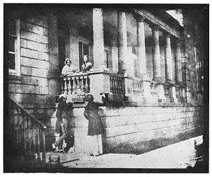 Early photograph showing people, including Sir Charles Lemon, left, at one of the colonnaded wings, taken in August 1841 by Henry Fox Talbot Carclew 1841 (1).jpg