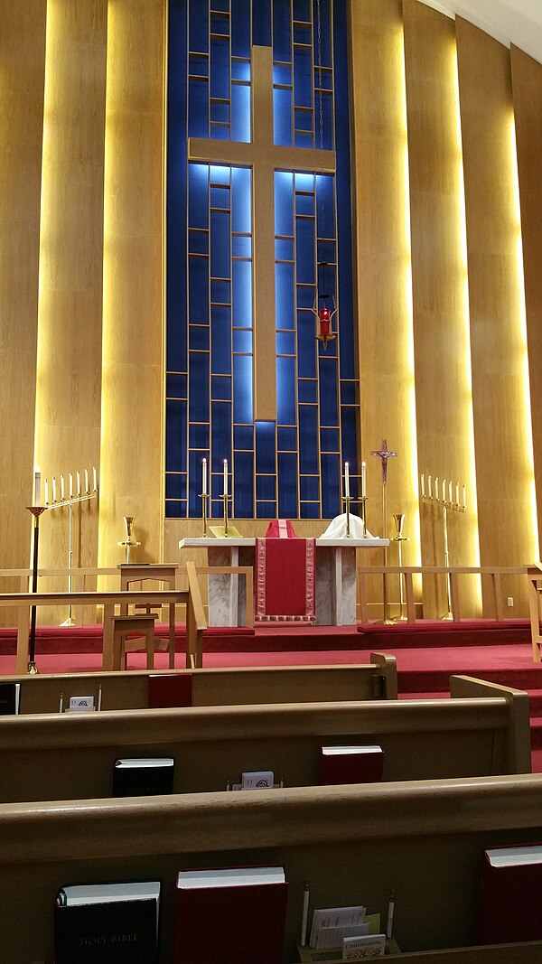 The chancel of a Lutheran church decorated with red paraments, the liturgical colour of the last week of Lent, Holy Week, in Lutheran and Anglican Chu