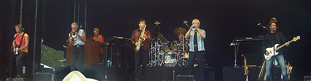 Chicago in 2004 (l–r): Howland, Pankow, Champlin, Parazaider, Imboden, Loughnane, Scheff, and Lamm (behind Scheff)