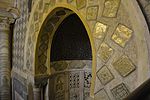 Detail of the mihrab, showing the square luster tiles around the upper section