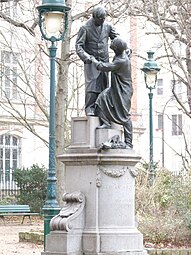 Monument à Jean Leclaire (1896), Paris, square des Épinettes. Le groupe en bronze a été refondu en 1971.
