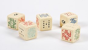 A set of poker dice owned by a member of the Royal Indian Army Service Corps during the Second World War Dice, game (AM 2015.20.16-2) (cropped).jpg