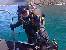 Diver boarding using ladder on RIB Diver boarding using dive boat ladder P3070567.jpg