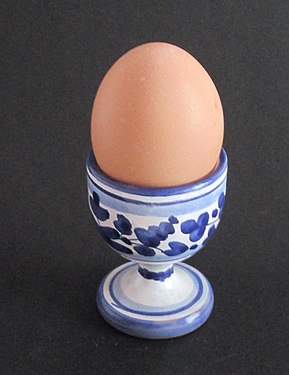 An illustration of an egg cup with egg