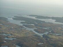 The islands of Eileanan Chearabhaigh at centre, with mainland Benbecula in the foreground and the northern tip of Wiay beyond Eileanan Chearabhaigh.jpg