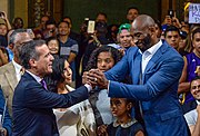 Bryant holds Eric Garcetti's, Mayor of Los Angeles, hand after declaring August 24 as "Kobe Bryant Day" (24 August 2016)