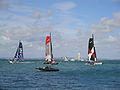 Extreme 40 class sailing catamarans, seen racing off Egypt Point, Cowes, Isle of Wight during Cowes Week in 2011. Cowes was a stage on the Extreme 40 races for 2011. Races were run off Egypt Point (by the Extreme 40 tent), and were separate from the standard Cowes Week races (that start from the Royal Yacht Squadron).