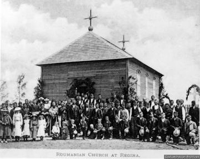 Romanians in front of the Romanian Orthodox Church of Regina, the first Romanian church in North America (1904)
