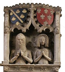 Since 1376 Godfrey and Avena de Foljambe, Lord Chief Justice of Ireland, have appeared to look out of a window. Foljambe Monument in Bakewell cutout.jpg