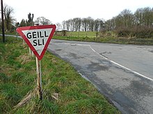 Irish-language road sign on a road junction in the southeast of Baile Ghib