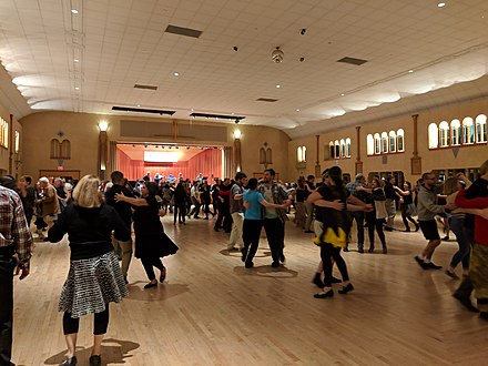 Contra dancers swing at a Friday night dance in Glen Echo Park's historic Spanish Ballroom