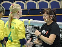 Brazil #4 having eyeshades checked. Goalball World Championships, Malmo, Sweden (June 2018). Goalball-2018 World BRA F eyeshade check.jpg