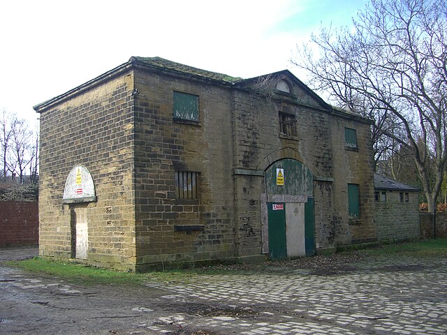 The coach house and stables before restoration in 2013.