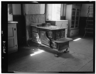 Stove in manse Historic American Buildings Survey John A. Bryan, Photographer July, 1952 STOVE, CHAPEL - Chapel and Manse Congregational Mission, Santee, Knox County, NE HABS NEB,54-SANT.V,2-8.tif