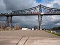 * Nomination: Intermodal freight train crossing the Kiel Canal in Rendsburg --MB-one 15:52, 29 October 2023 (UTC) * Review Mostly good, but there's a lot of foreground that could be cropped, and I think the perspective is a bit off (lamp-post on right not vertical, bridge tilted), fixable? --Mike Peel 07:17, 30 October 2023 (UTC)