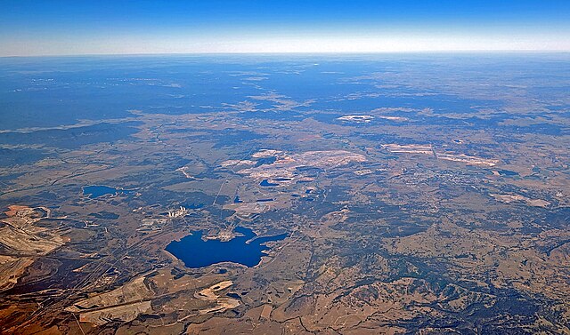 The Hunter River meanders around coal mines and power plants in this aerial view.