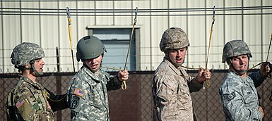 JCSE communicators from the Air Force, Army, and Marine Corps rehears aircraft procedures for an upcoming parachute jump, 2016 JCSE operators go through parachute drills.jpg