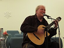 Jim Scott singing at a concert of mostly Pete Seeger songs at the Unitarian Universalist Fellowship of Athens in 2017 Jim Scott.jpg