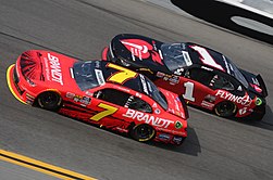 Allgaier racing his JR Motorsports teammate Michael Annett at Daytona in 2019. Justin allgaier (40197690673).jpg