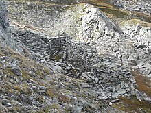 Remains of a destroyed Austro-Hungarian weapons cache, Marmolada Karnischer-Hoehenweg Kriegsruine.jpg