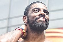 Kyrie Irving during the 2016 NBA Champions victory parade.jpg