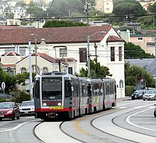 Muni Metro, run by SF Muni L Taraval train on Ulloa Street, June 2017-001 (cropped).JPG