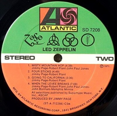 The original vinyl record label with the four hand-drawn symbols