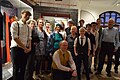 Acting and support cast of Little Edens pose infront of a display featuring the history of the Cutteslowe Walls.