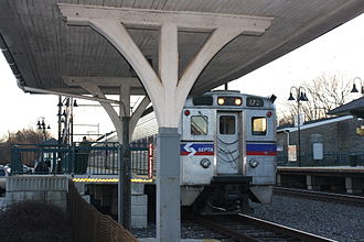 A SEPTA Regional Rail train in Cheltenham, Pennsylvania, a form of commuter rail Melrose RR Station 02.JPG