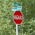 Mi'kmaq language stop sign in Elsipogtog First Nation, Canada, street names in English