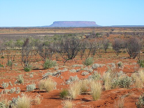 View across sand plains and salt pans to Mount Conner, Central Australia
