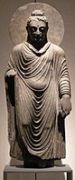 Statue of the Buddha, Takht-i-Bahi, 2nd–3rd century CE. Schist, H. 980 mm (39 in). Museum für Indische Kunst.