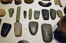 An array of Neolithic artifacts, including bracelets, ax heads, chisels, and polishing tools. Neolithique 0001.jpg