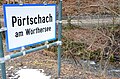 English: Place name sign and mill brook Deutsch: Ortstafel und Mühlbach