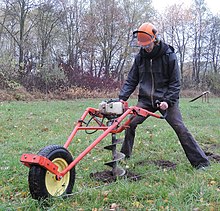 Gasoline-powered portable earth auger. Pflanzfuchs earth auger in Mecklenburg-Vorpommern.jpg