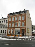 Apartment building in half-open development