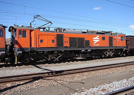 No. E7293, right side, in Spoornet orange livery and inscribed 7E5 at Vryheid, KwaZulu-Natal, 16 August 2007