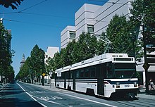 A light rail car of the type in use until 2003, northbound on First St. in downtown, on the section of line that opened in June 1988 San Jose LRV 809 northbound on First St near San Carlos St (1993).jpg