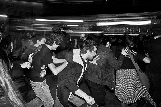 Audience members moshing to Toxic Holocaust